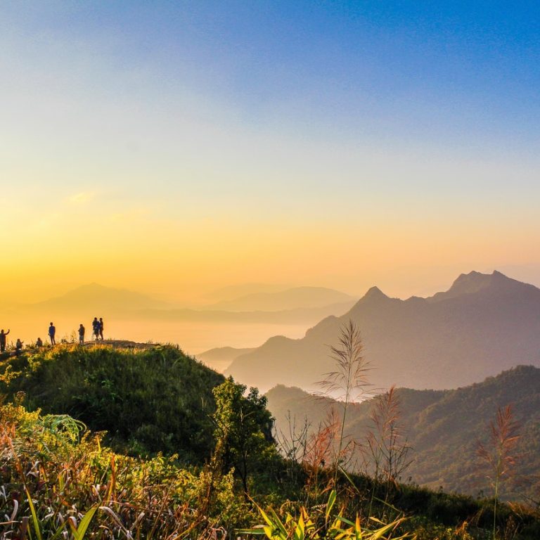 photo of people standing on top of mountain near grasses 733162.jpg